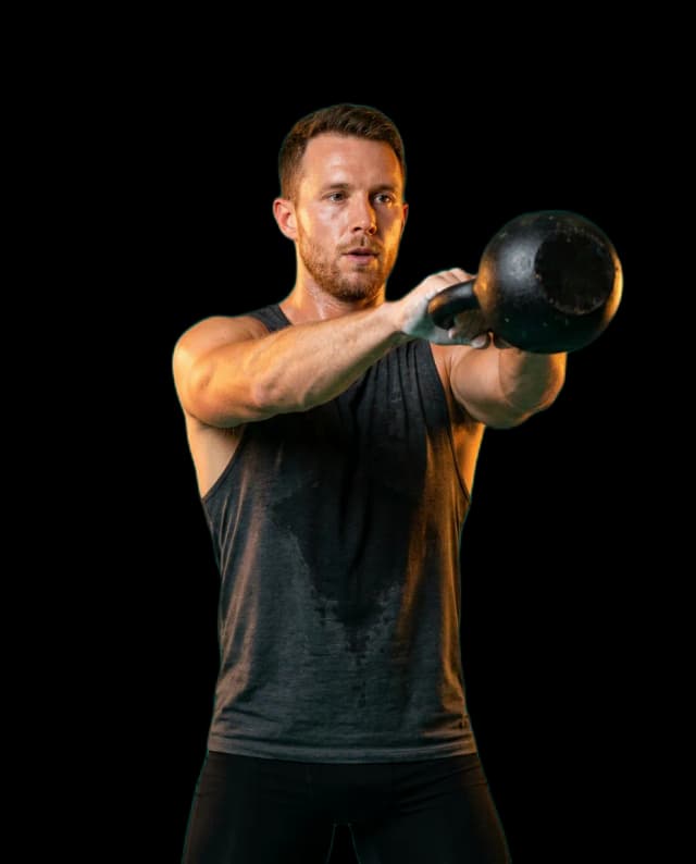 Athlete in flow state performing a kettlebell swing during an interval timer workout